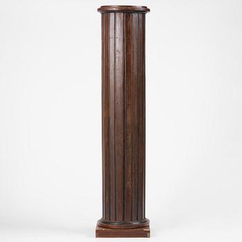 A Swedish Empire column-shaped cabinet, first part 19th century.