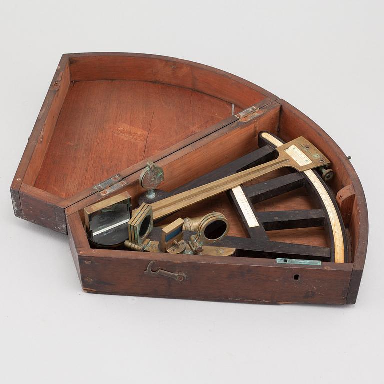 A turn of the century 1900 octant with case by F.M Moore.