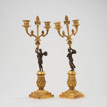 A pair of Empire early 19th century two-light candelabra.