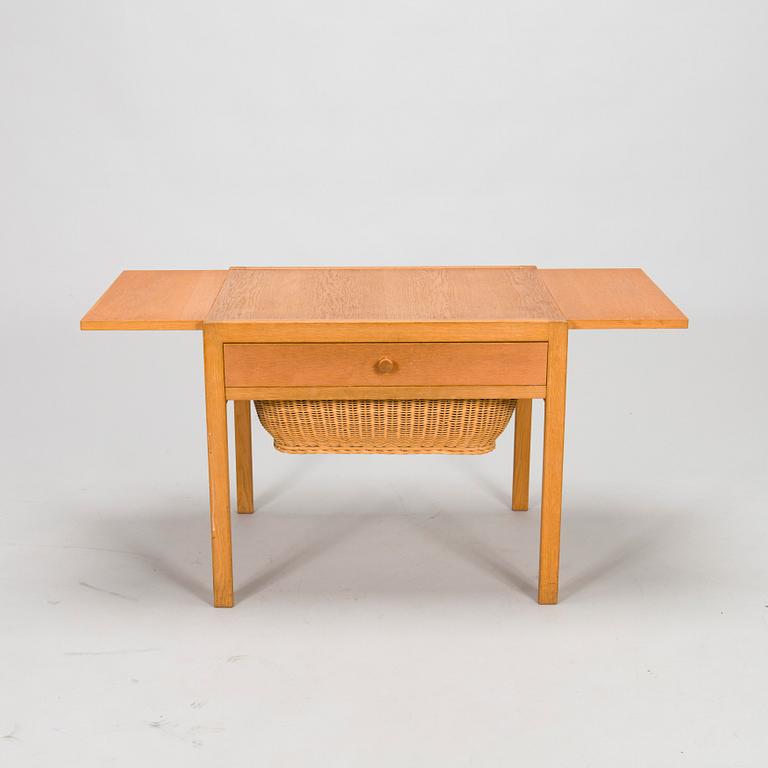 A mid-20th-century sewing table.