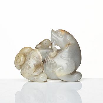 A nephrite sculpture of a mythical creature with a lingzhi fungus, late Qing dynasty.