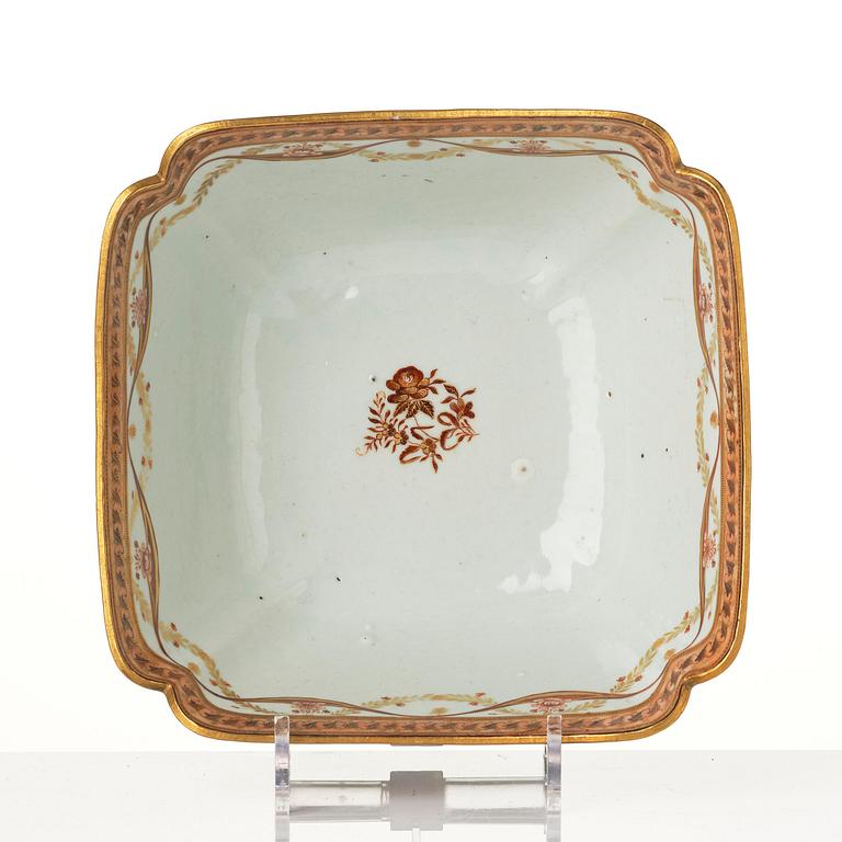 An oval vegetable tureen with cover and a pillow shaped bowl, Qing dynasty, late 18th century.