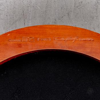 A cherry wood model 606 'Barrel' chair by Frank Lloyd Wright from Cassina.