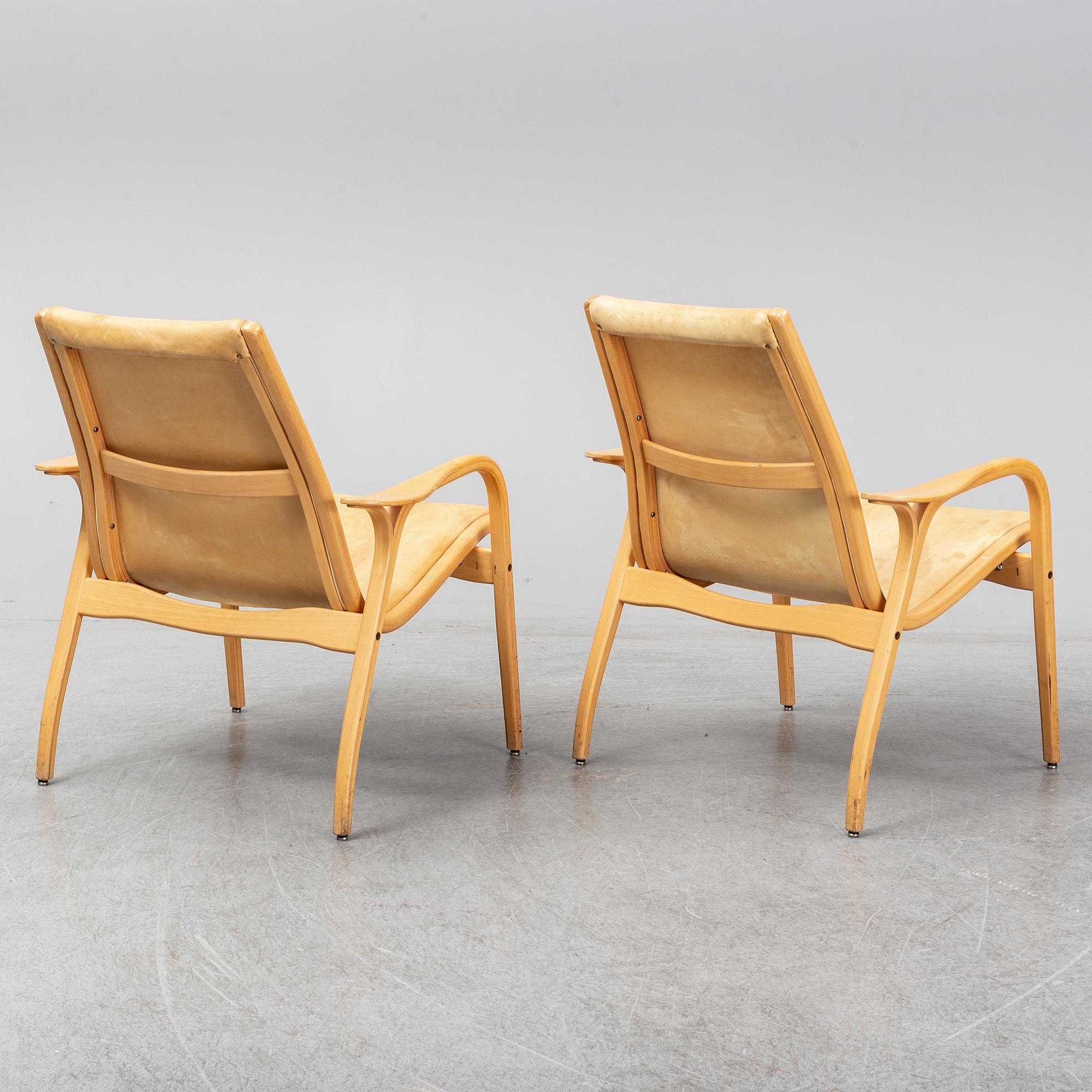 A pair of Laminett Yngve Ekström chairs.