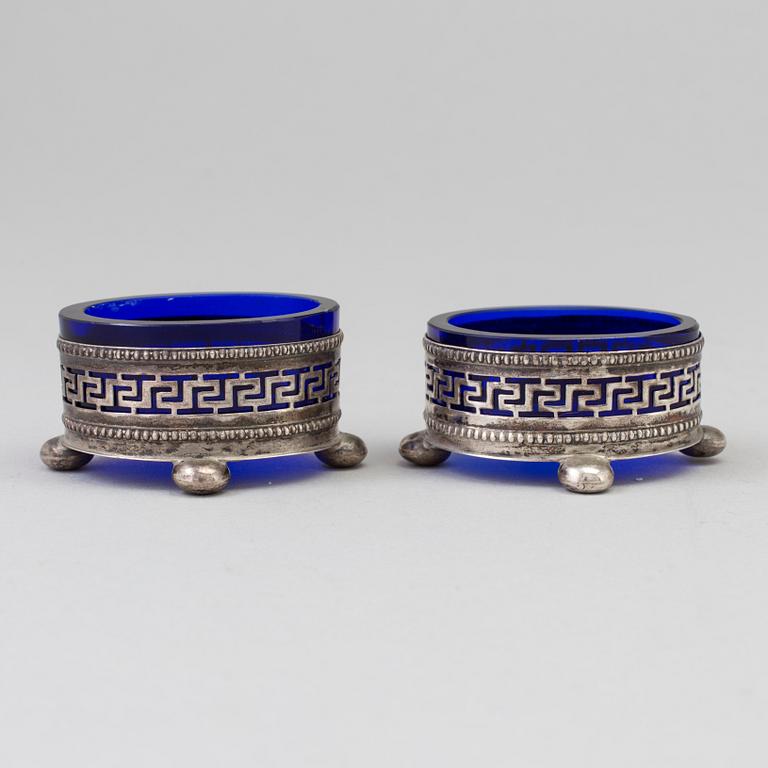 A Pair Of Neoclassical Silver And Glass Salt Cellars, early 20th century.