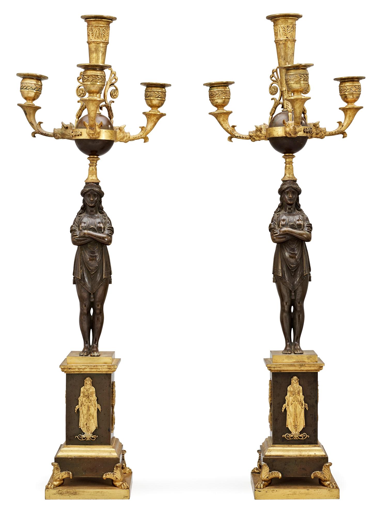 A pair of French Empire early 19th century four-light candelabra.
