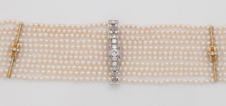 A cultured saltwater pearl and diamond choker necklace. Total carat weight 1.00 ct.