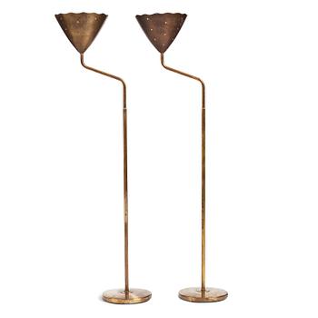 A pair of Swedish Modern brass uplights, 1940's.