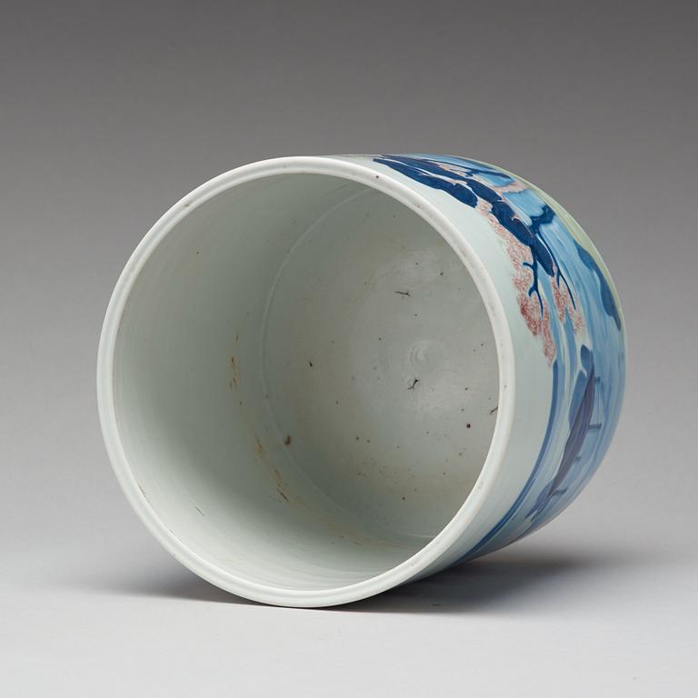 An underglaze blue, copper-red and celadon-glazed brushpot, Qing dynasty, early 18th Century, with Chenghuas mark.