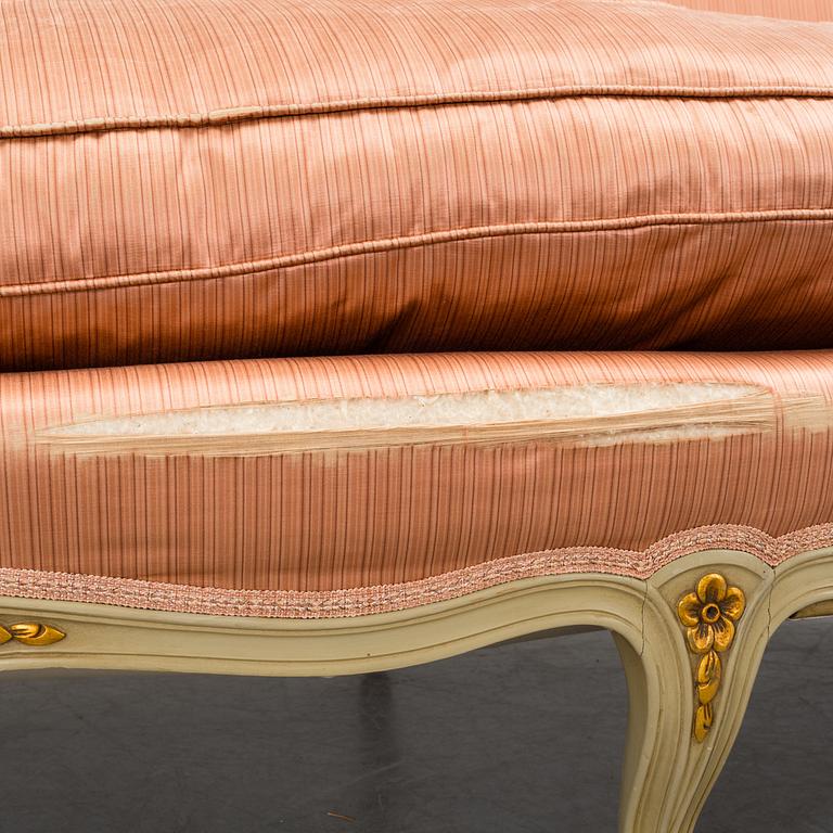 A late 20th century rococo-style sofa.