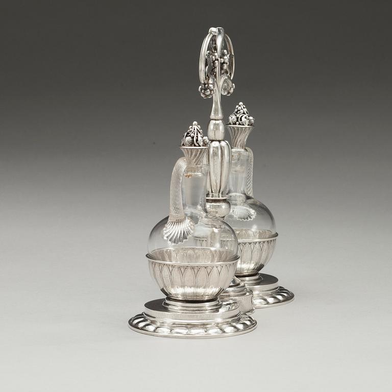 A Georg Jensen 830/1000 silver cruet-stand, Copenhagen 1921.