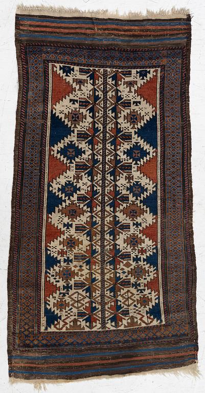 An antique Baluch rug, East Persia, c. 147 x 45 cm.