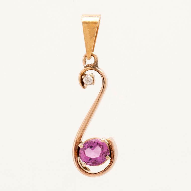 Pendant in 18K gold with an oval faceted pink sapphire and a round brilliant-cut diamond.