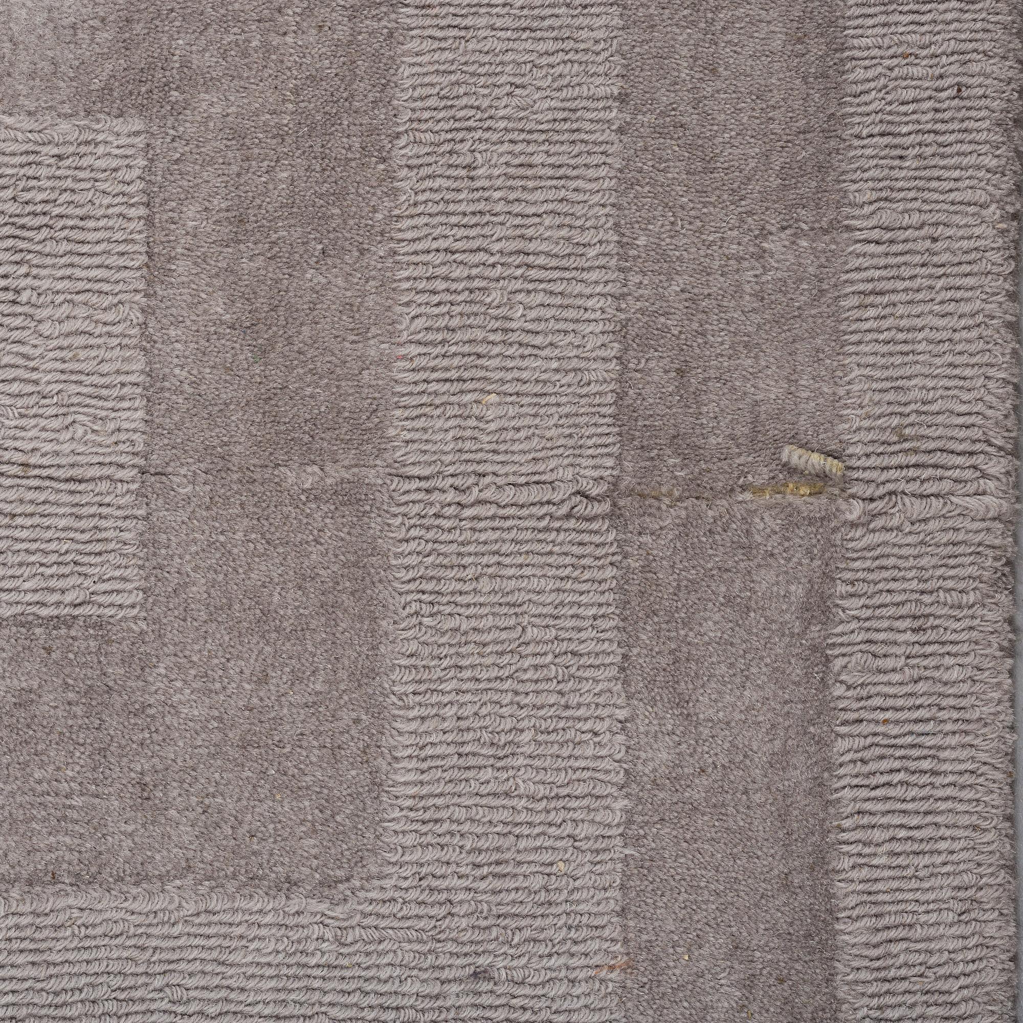 A Layered "Wool Cubes" carpet, 390x620 cm.