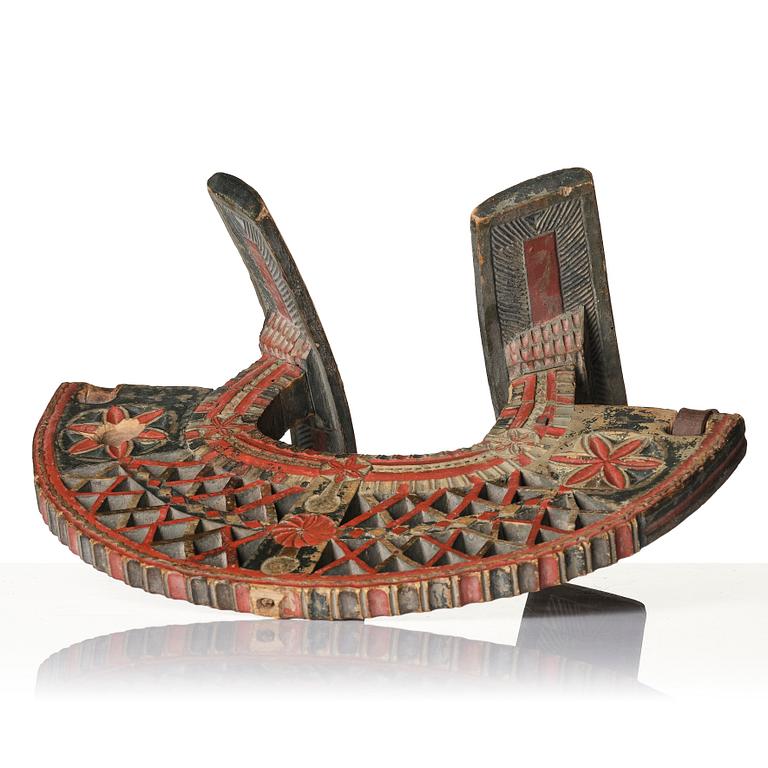 A Swedish folk art carved and polychrome-painted part horse harness, Uppland, dated 1774.