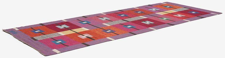 Agda Österberg, a flat weave and tapestry weave carpet, c. 330 x 123 cm, signed AÖ.