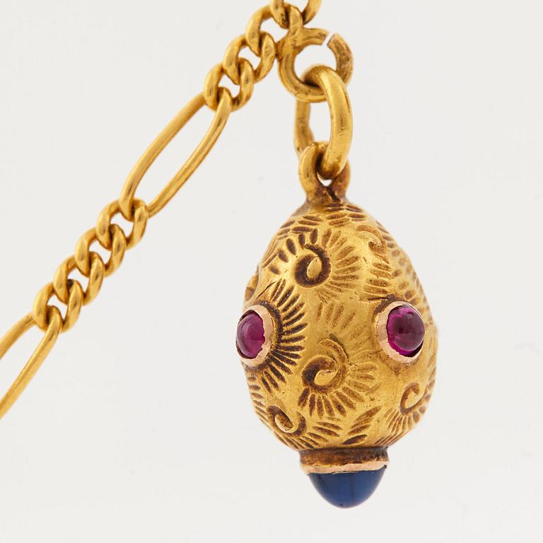 A FABERGÉ  GOLD Chain Necklace WITH 9 GOLD, ENAMEL ETC MINIATURE EASTER EGG PENDANTS, S.T PETERSBURG 1899-1908.