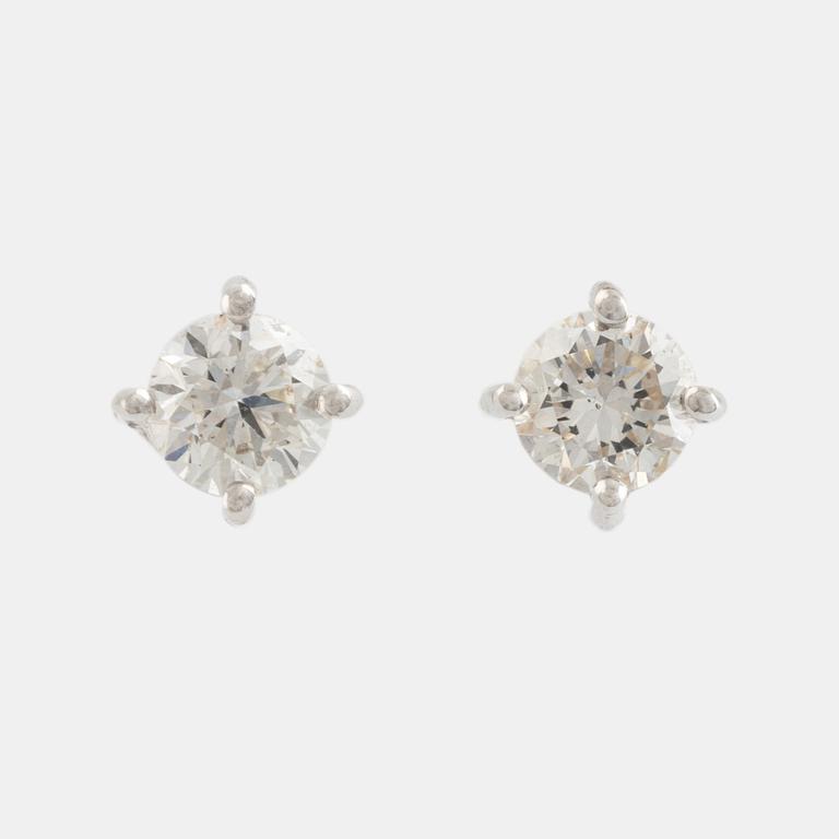 Brilliant cut diamond stud earrings.
