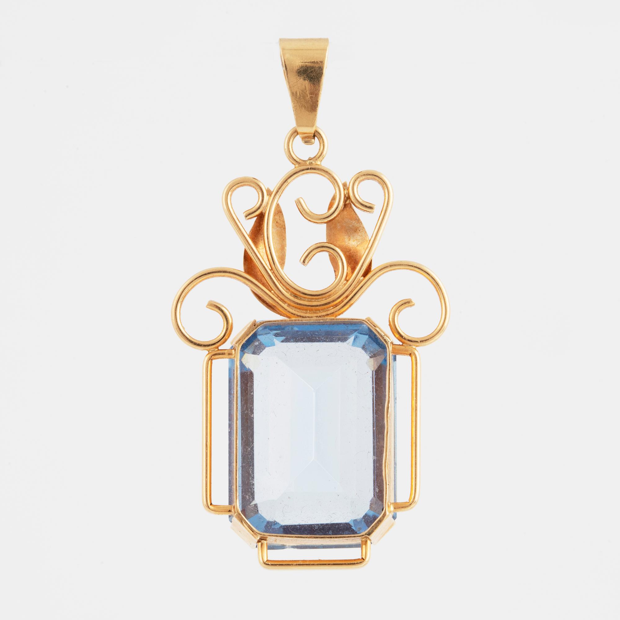 Blue synthetic spinel and 18K gold pendant.