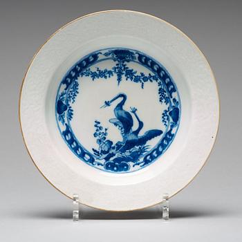 A set of eight blue and white armorial soup dishes, Qing dynasty, 18th Century.