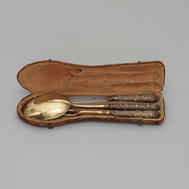 A German 17th century silver-gilt and filigree three-piece travel cutlery, unmarked.