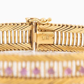 Armband 18K guld med rosa stenar.