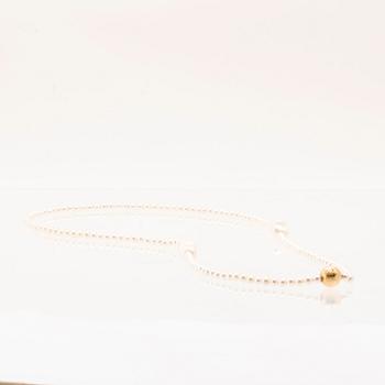 Ole Lynggaard, two cultured pearls necklaces and a bracelet with 18K gold clasp.