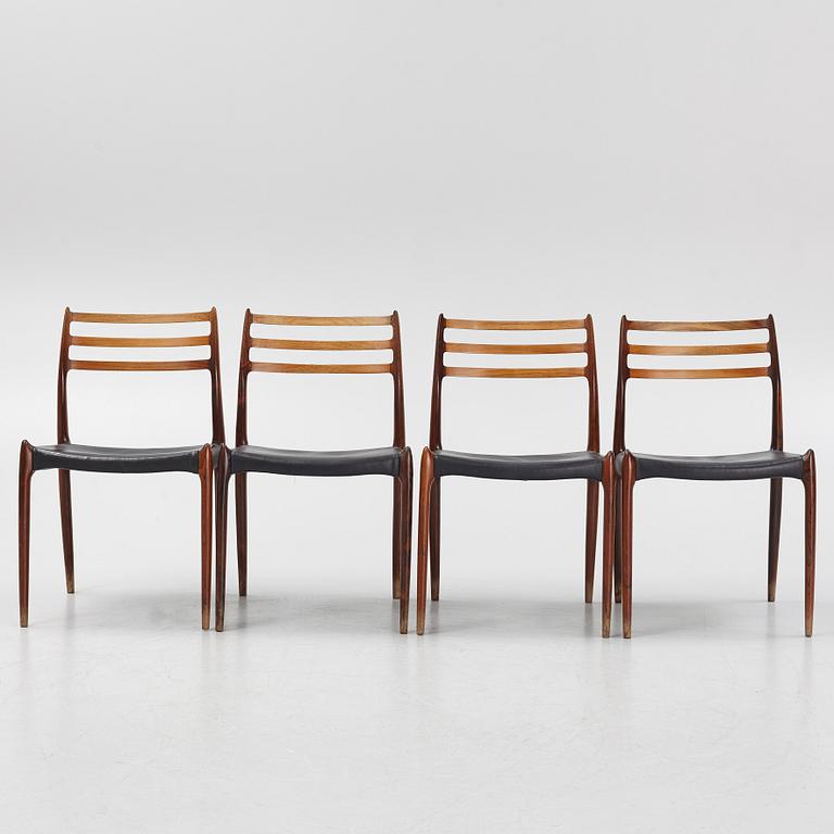 Niles Otto Møller, a rosewood veneered table with four chairs, JL Møller, Denmark, 1950's/60's.
