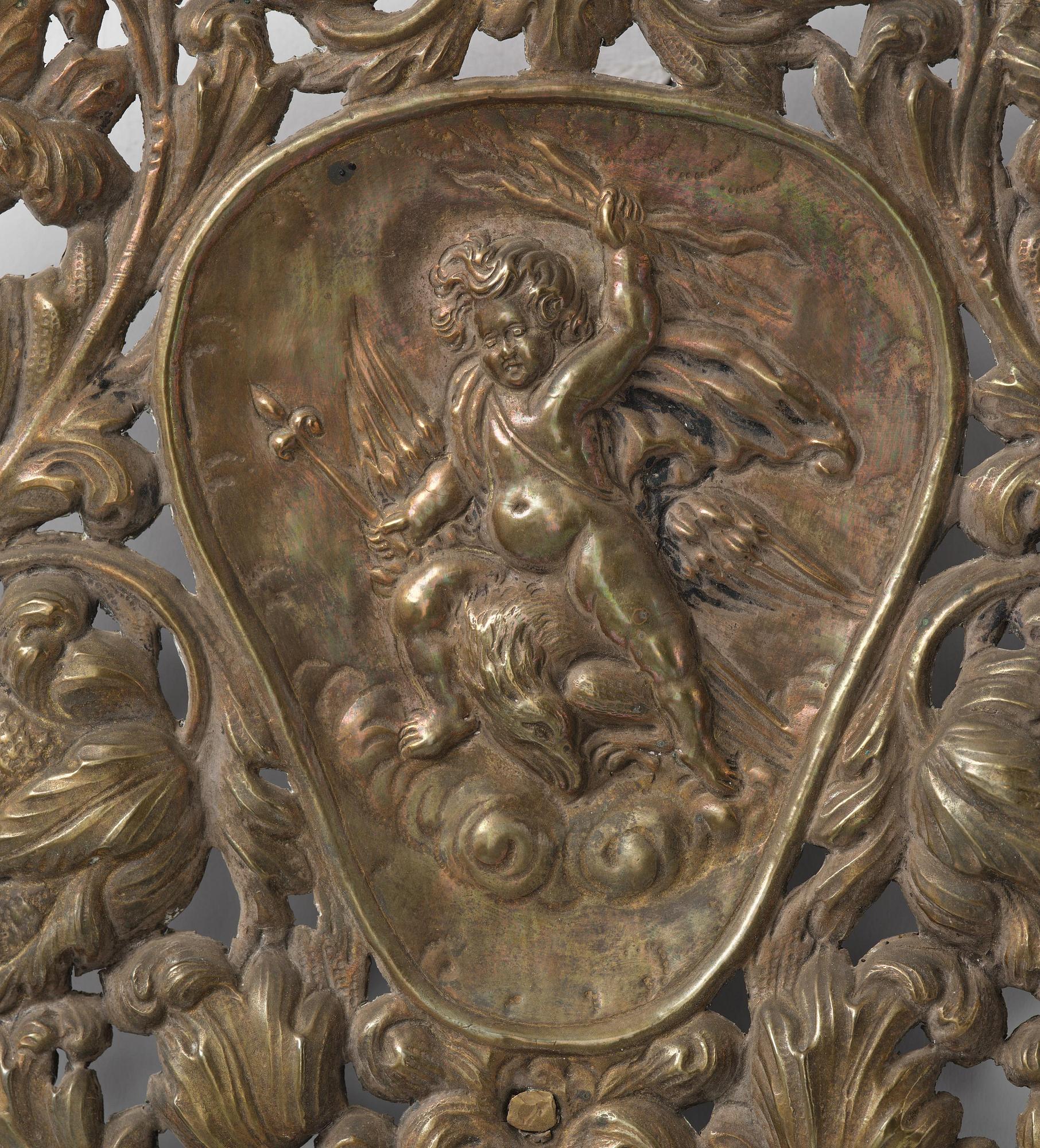 A set of four Swedish Baroque repoussé silvered brass reflector one-branch reflector plates, ca 1690-1700.
