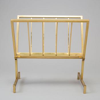 a brass magazine shelf.