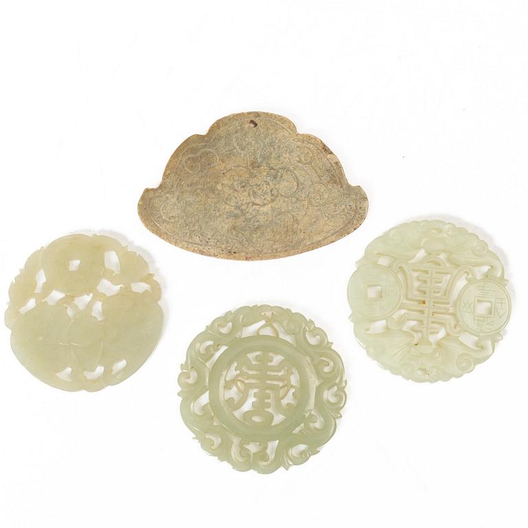 A group of four Chinese stone amulets / plaques, 20th century.