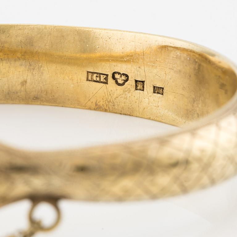 Bangle in the shape of a snake, 18K gold with garnets as eyes, Johan Gustaf Kihlberg, Nyköping 1863.