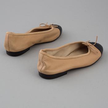 Ballerina shoes by Chanel.