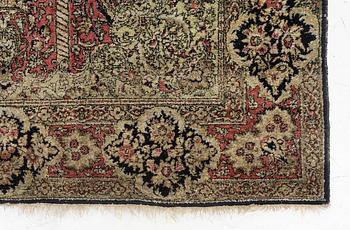 A semi-antique silk Quum, c. 216 x 141 cm.