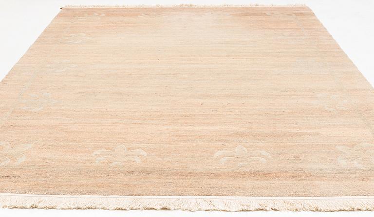 A Chinese carpet, c. 330 x 270 cm.