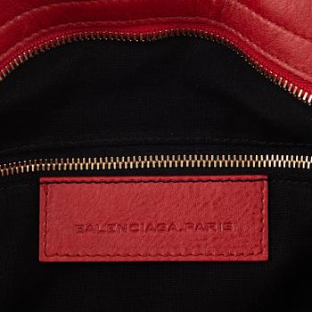 Balenciaga, a red leather 'City' bag.