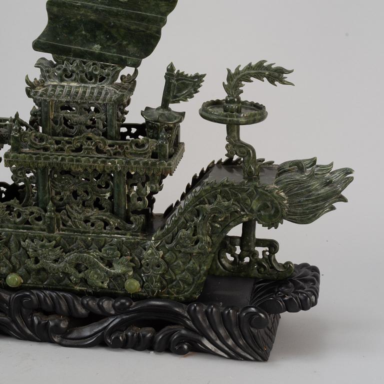 A large Chinese green stone carved sculpture, 20th century.