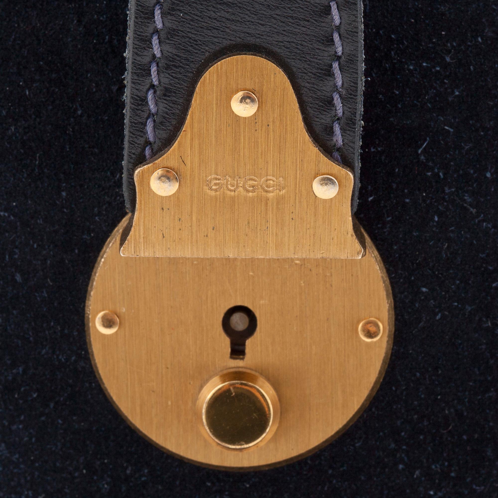 GUCCI, a blue suede and leather weekendbag.