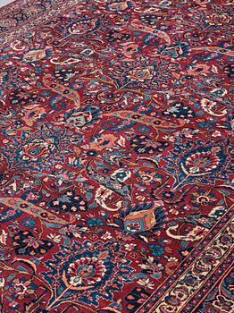 A CARPET, a semi-antique Mashad, ca 400-404 x 314 cm.