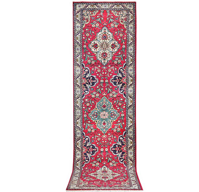 A runner carpet, Tabriz, c. 402 x 88 cm.