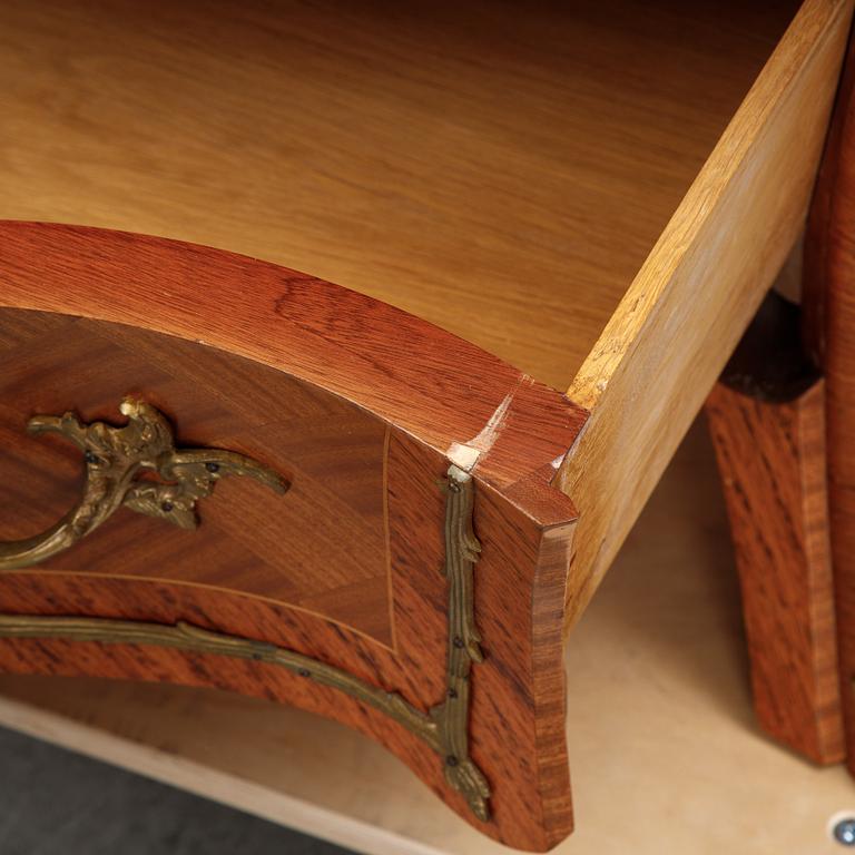 A pair of rococo style chest of drawers, mid 20th Century.