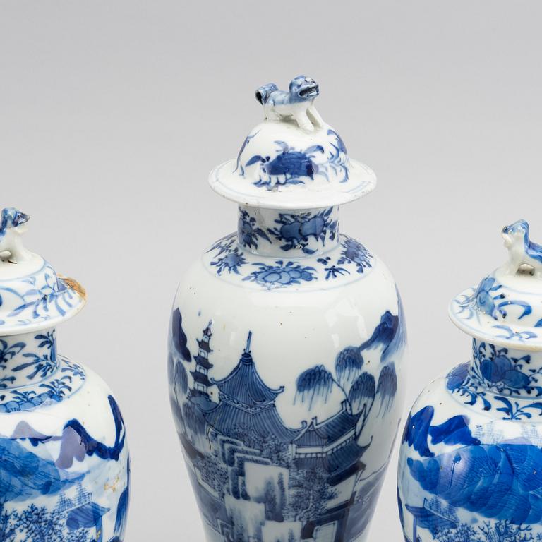 A set of three blue and white porcelain urns 19th century.