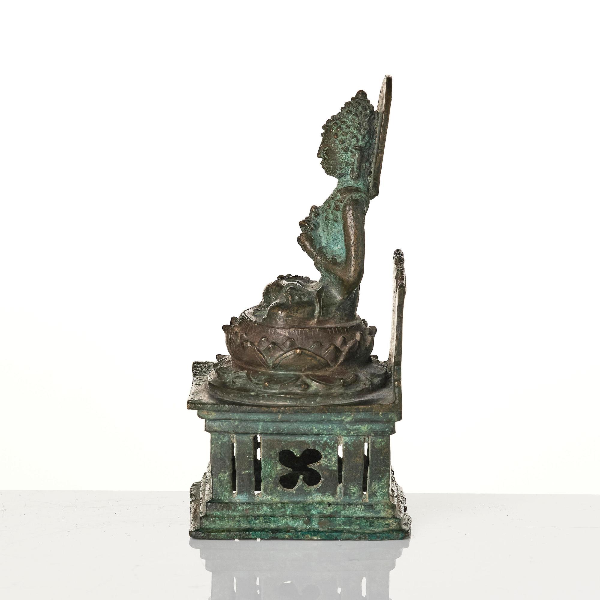 A bronze Buddha Vairocana, Eastern Java, 10th century.