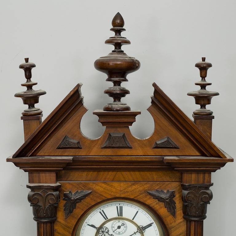 A late 19th century wall pendulum clock.