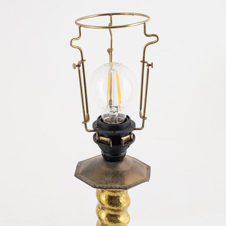 Two Baroque style brass table lamps from around the year 1900.