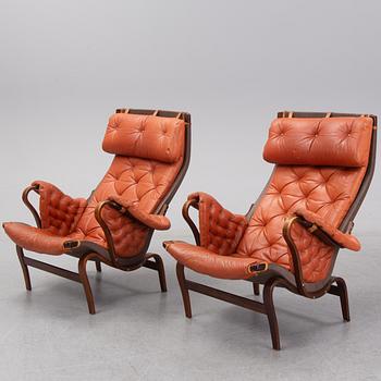An end of the 20th Century pair of 'Pernilla' easy chairs with leather upholstery by Bruno Mathsson for DUX.