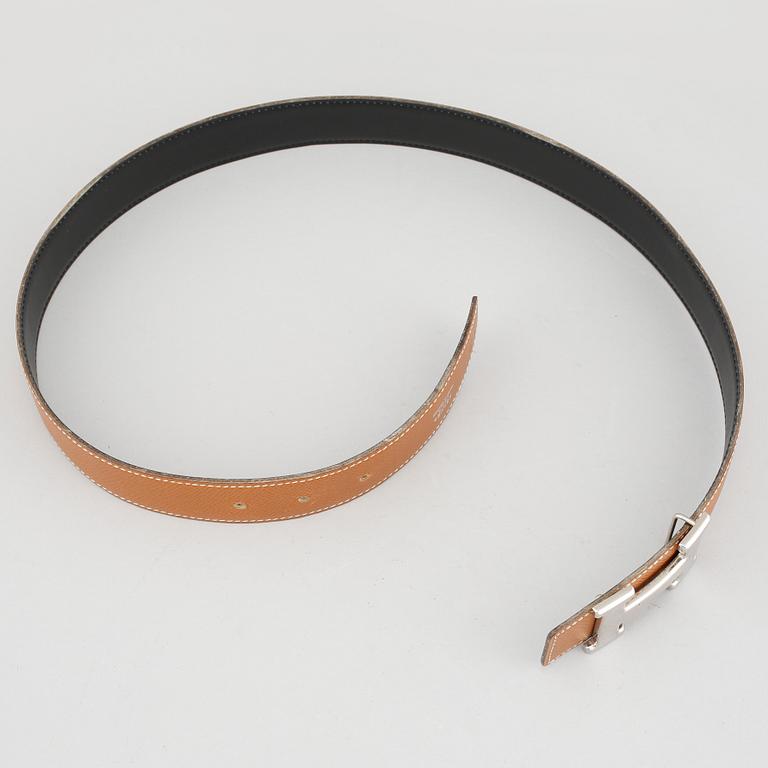 A leather belt from Hermès.