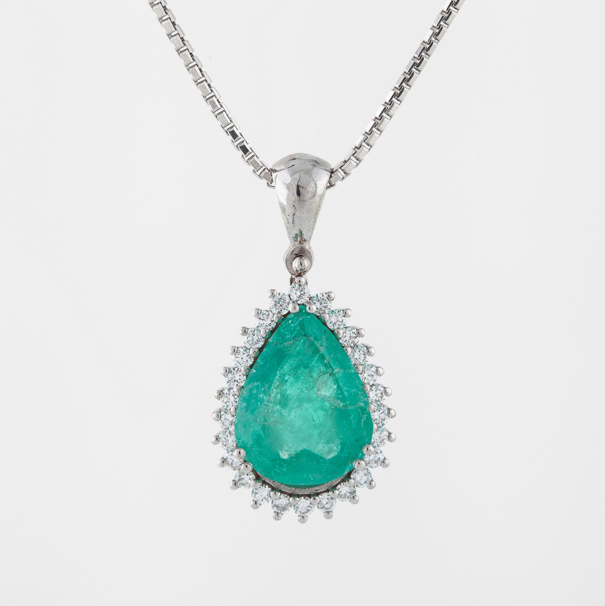 An emerald and brilliant cut diamond pendant.