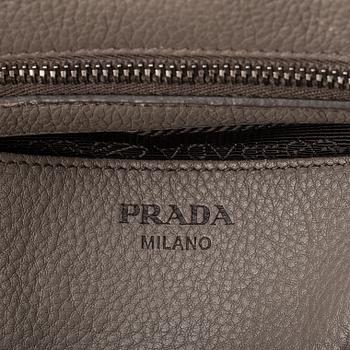 Prada, a leather handbag.