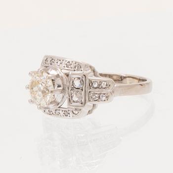 An 18K white gold ring set with an old cut diamond and rose cut diamonds.